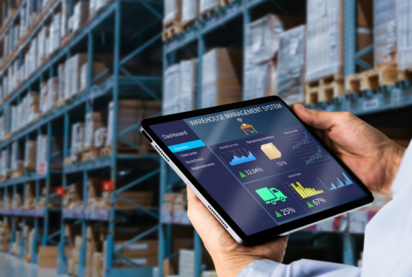 Dashboard with various graphs and charts displayed on a handheld touch screen device in a warehouse